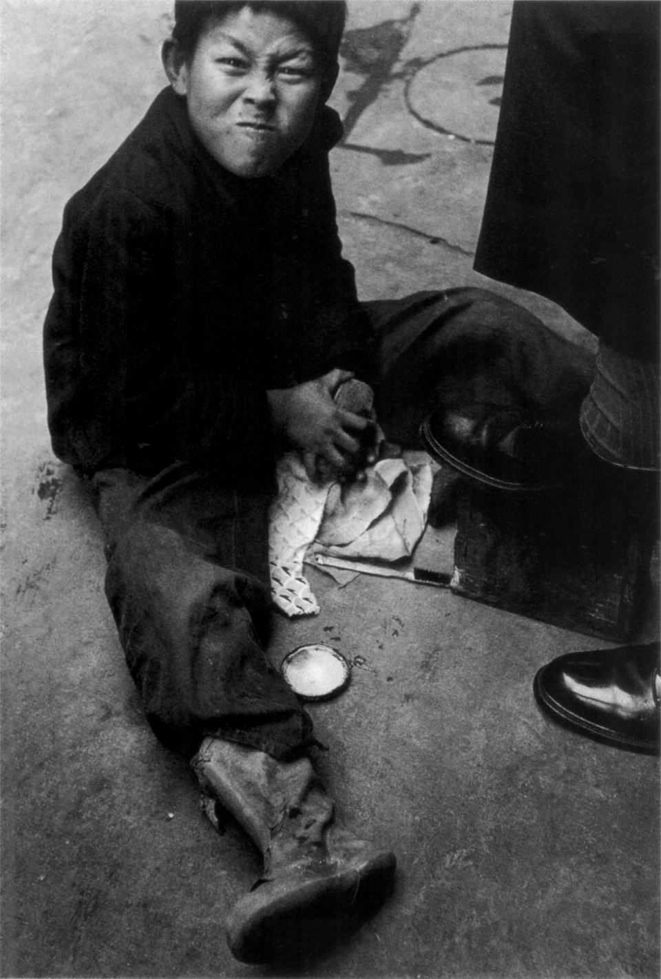 Japanese Realism Photography — Ken Domon, Shoeshine Boy in Ginza, ca. 1951 — Wikimedia Commons / Public domain