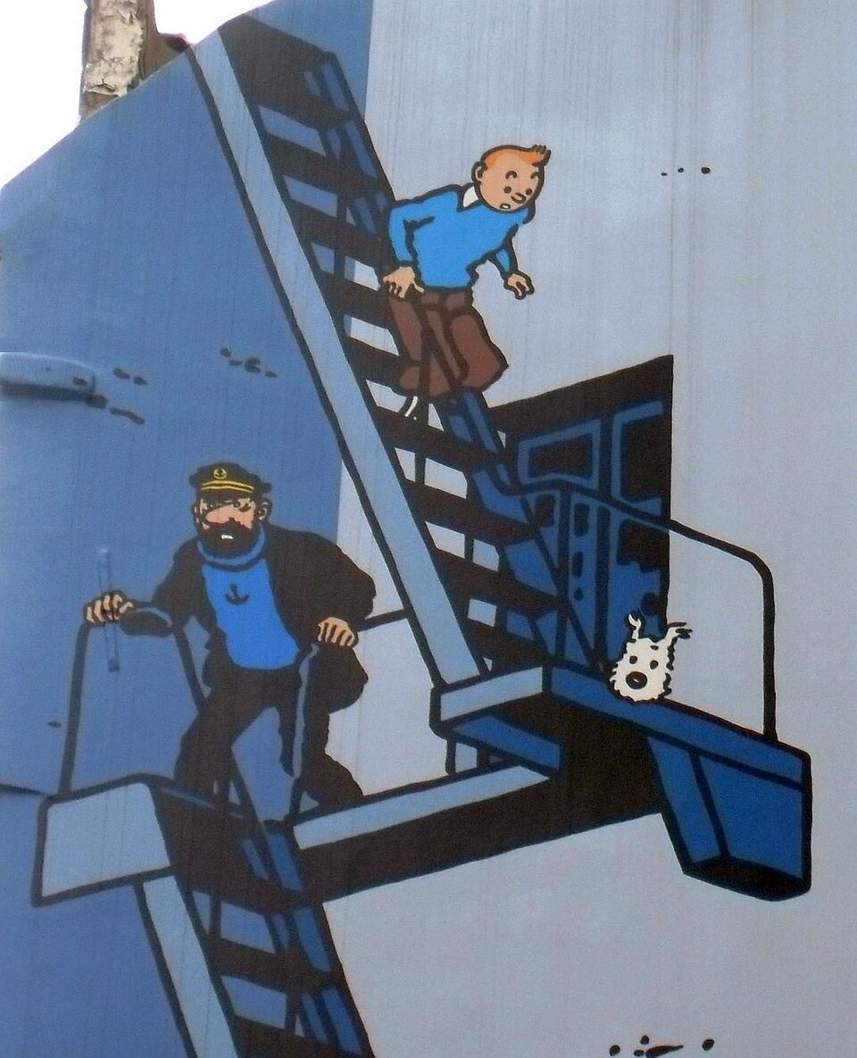Ligne Claire — Hergé, The Adventures of Tintin mural (Rue de l'Étuve, Brussels) — Wikimedia Commons / CC BY-SA 3.0 · © Ferran Cornellà