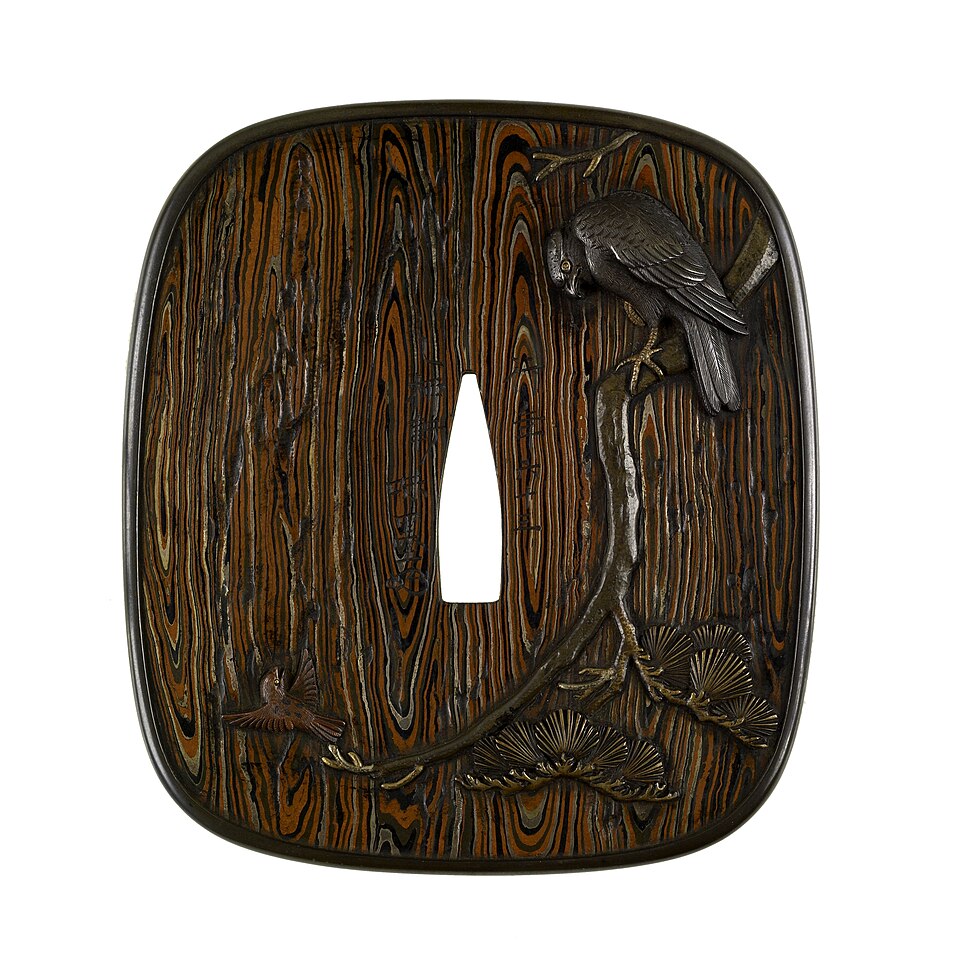 Mokume-gane — Hamano Masanobu, sword guard (tsuba) with hawk and sparrows, 1836, Walters Art Museum — Wikimedia Commons / Public domain